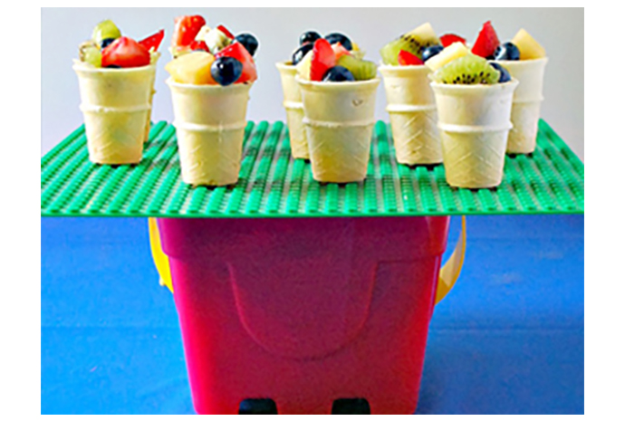 Keep it simple. All you need are ice cream cones and a mixture of fruit—woot woot!