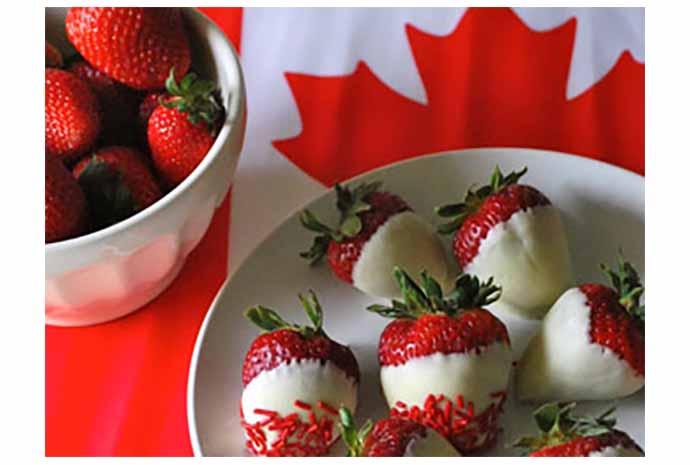 Strawberries dipped in white chocolate make for a sweet way to display our national colours.