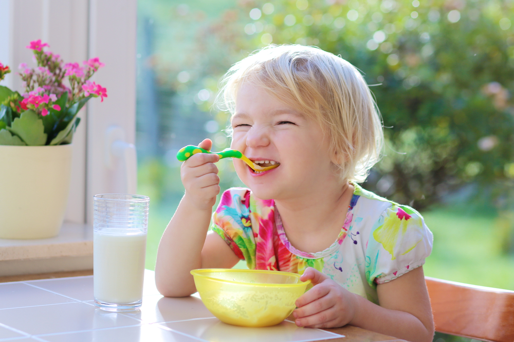 Child Enjoying Breakfast