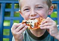 Boy enjoying pizza