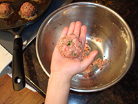 Child making meatballs