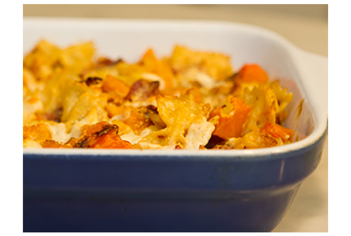 For a casual entertaining meal that you can pop in the oven while guests are busy, make this delicious baked pasta recipe ahead of time. The pancetta gives the rich and creamy sauce a nice crunch and the squash gives it a healthy richness.  
