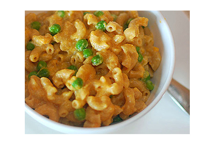 The kids beloved mac 'n' cheese becomes a healthy Family Meal with a dose of sweet potato and some green peas thrown in. This is definitely a case of what they don't know won't kill them.