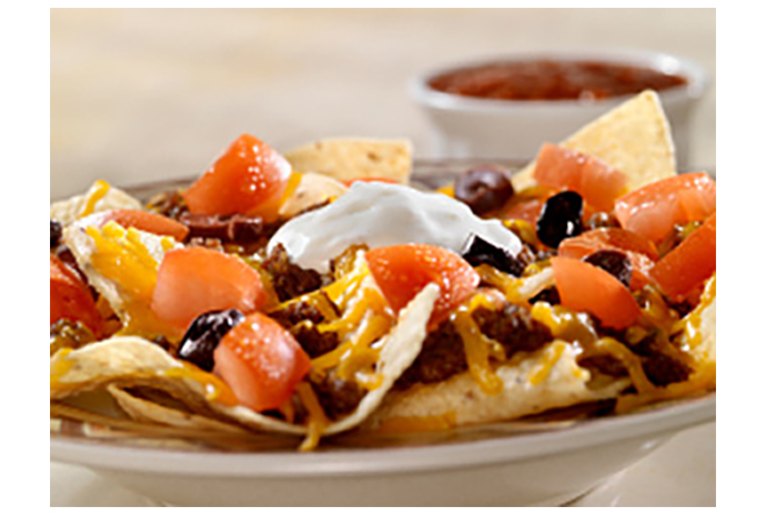 Veggies, beans and cheese make Bedrock Black Bean Nachos a delicious snack the entire family can enjoy.