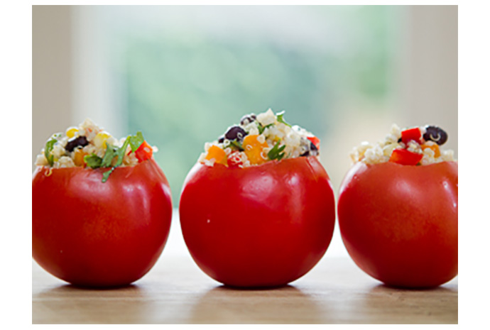 Quinoa, the new and popular superfood, isn't just for health food lovers anymore. Stuff this delicious quinoa salad into a juicy seasonal field tomato and you'll be handing out the recipe as they leave the house.