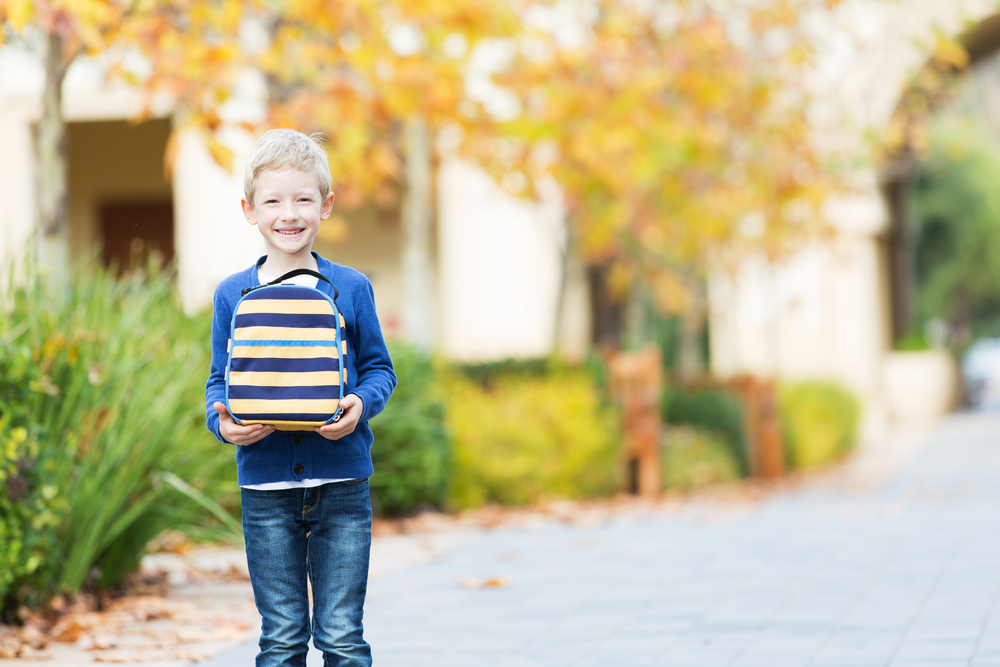 Kid Holding Lunchbox Outside