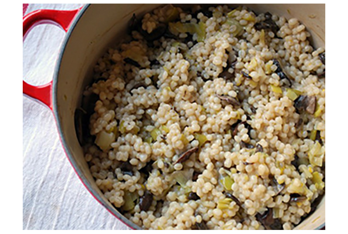 When you know you have a busy week ahead, make a pot of this baked barley pilaf, and store in the fridge for a tangy and nutritious side dish. Top it with a fried egg (for protein) and it quickly becomes a 10-minute meal. It also freezes well, and will keep for up to five days in the fridge.