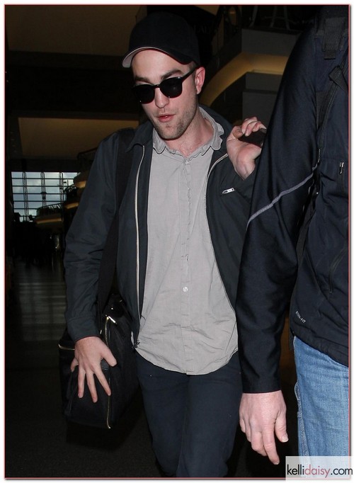 Actor Robert Pattinson departs from the LAX airport in Los Angeles, California on February 15, 2012.