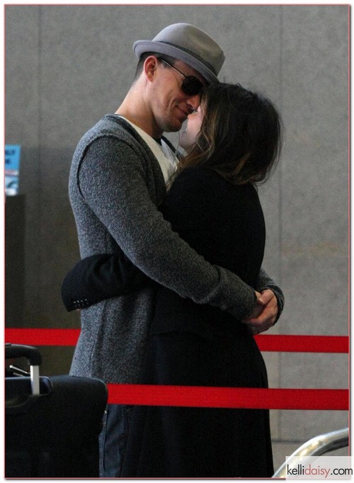 Actor Channing Tatum and his wife actress Jenna Dewan cuddled up to one another while checking into a flight out of the LAX Airport at Los Angeles, California on February 12, 2012.