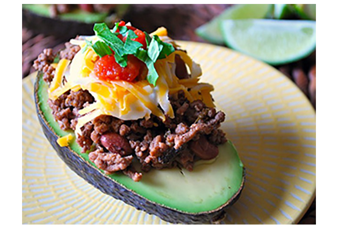 For easy entertaining, make the meat mixture for these hearty stuffed avocado shells in advance and stuff them just before serving.