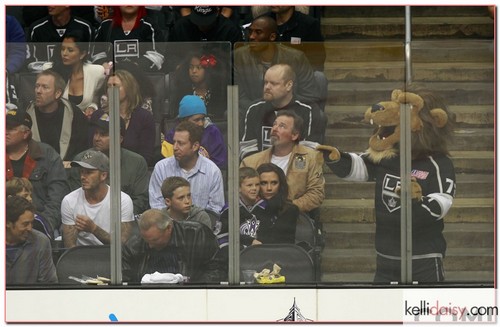 David Beckham and wife Victoria Beckham take their sons Brooklyn, Romeo and Cruz to the Los Angeles Kings vs. Vancouver Canucks NHL playoff game at the Staples Center in Los Angeles, California on April 15, 2012. Laker star Kobe Bryant and his estranged wife Vanessa sat a couple of rows back with their two daughters