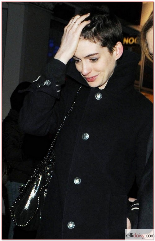 &quot;The Dark Knight Rises&quot; actress Anne Hathaway and her fiance Adam Shulman leave The Box nightclub in London with amazing short hair on April 7, 2012. The beauty is currently in the UK filming &quot;Les Miserables&quot; and has had her locks cut for the role. RESTRICTIONS APPLY: USA/AUSTRALIA/NEW ZEALAND ONLY