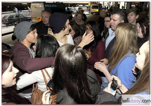 One Direction Land In London British boyband One Direction are swamped by fans as they land at Heathrow Airport on a flight from Auckland, New Zealand on April 24, 2012 in London, UK. RESTRICTIONS APPLY: USA/AUSTRALIA/NEW ZEALAND ONLY