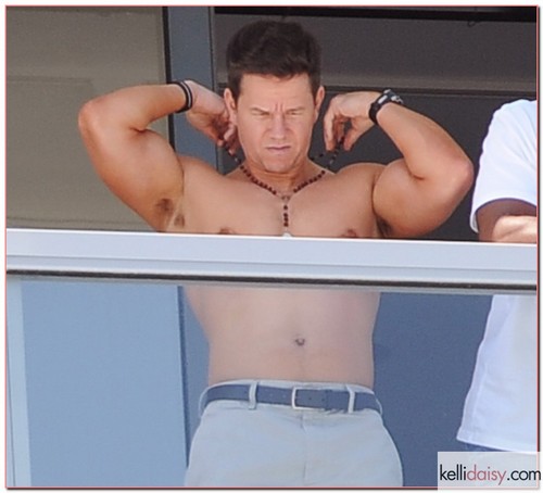 Actor Mark Wahlberg took a break from filming ?Pain and Gain? in Miami, Florida on April 1, 2012. He hung out on his balcony with his shirt off listening to some tunes and enjoyed the company of friends.
