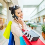 Woman Shopping in Mall on Phone