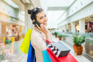 Woman Shopping in Mall on Phone