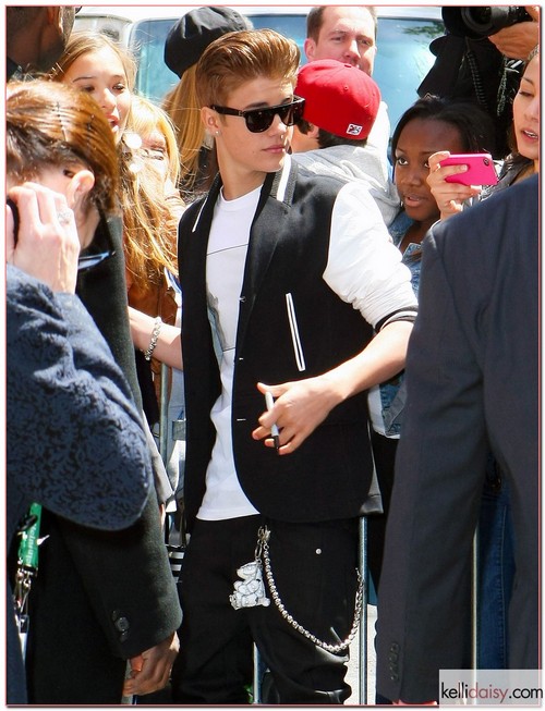Singer Justin Bieber getting mobbed by fans as he leaves a building in New York City, New York on April 27, 2012.