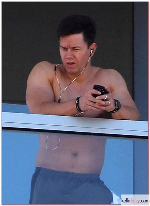 Actor Mark Wahlberg stepped out shirtless for a breath of fresh air on the balcony of his hotel in Miami, Florida on May 2, 2012.