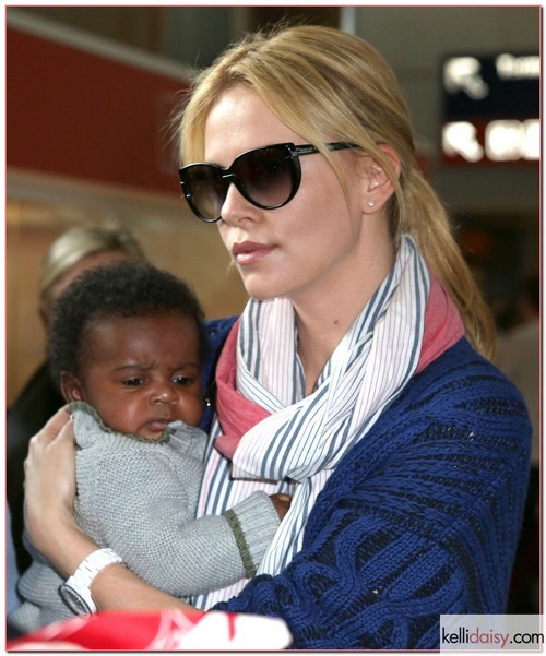 &quot;Young Adult&quot; star Charlize Theron carries her precious baby Jackson through the Charles de Gaulle airport after arriving on a flight in Paris, France on May, 8 2012. This is the first time her son has been photographed! RESTRICTIONS APPLY: USA/AUSTRALIA ONLY