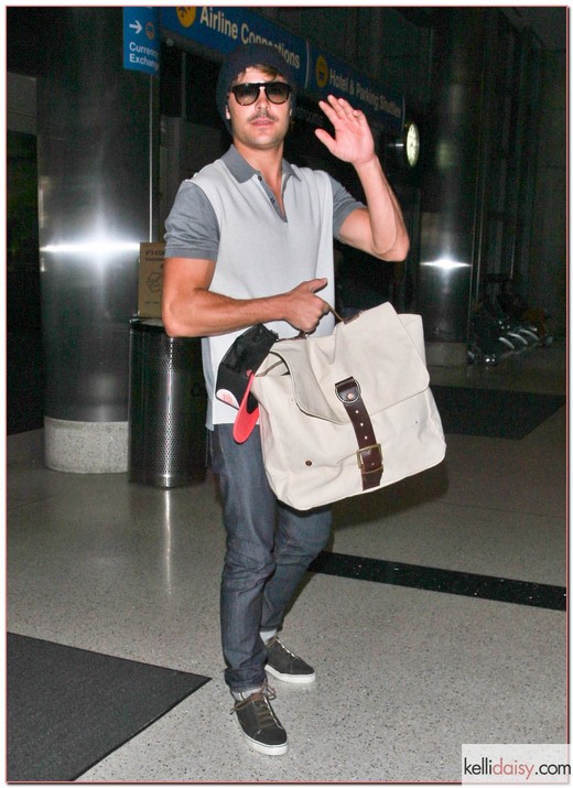 Zac Efron Leaves LAX "The Lucky One" star Zac Efron leaves LAX in Los Angeles, California on May 22nd, 2012.