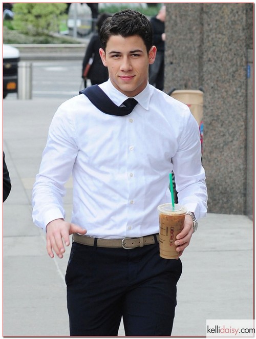 Musician Nick Jonas out getting some Starbucks with a friend in New York City, New Yokr on April 30, 2012