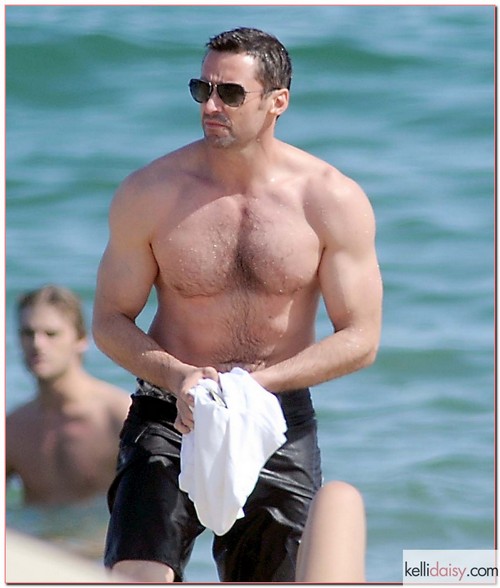 Looking More Like A 'Baywatch' Stud Hugh Jackman Hits Beach With His Family Looking more like a 'Baywatch' stud actor Hugh Jackman enjoys a few days of vacation with his family in Barcelona, Spain on June 20th, 2012. RESTRICTIONS APPLY: USA/AUSTRALIA ONLY