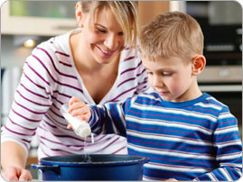Boy_adding_salt_BRAND_PHO_EN Boy_adding_salt_BRAND_PHO_EN