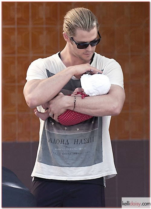 &quot;Thor&quot; star Chris Hemsworth's daughter India Rose looks so little in his massive arms as he lovingly holds her close. Hemsworth carried his baby as he strolled through Madrid, Spain with his mother-in-law Cristina Medianu on Monday 2, July 2012. His wife Elsa Pataky joined them later as they ran errands in the city and finally got dinner together.  RESTRICTIONS APPLY: USA/AUSTRALIA ONLY