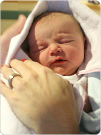 newborn_in_hands_EN