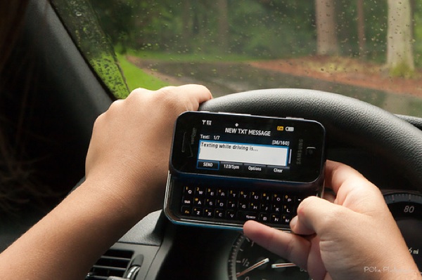 Texting while driving is ... (f/13, 1/50 sec, 48mm)