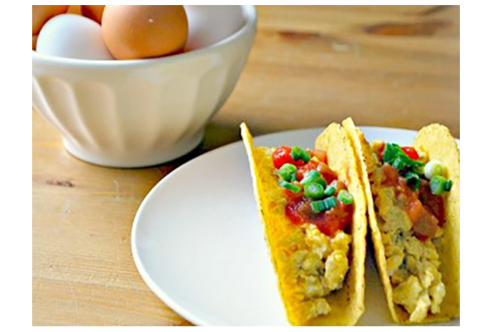 Scrambled eggs are dialed up a notch with the addition of cheddar cheese and chili powder. Tucked into a taco shell and dressed with your little one's favourite condiments, this kid-friendly meal is sure to earn a place in your weekly dinner rotation. 