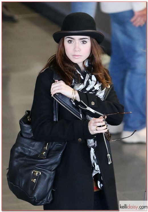 51030488 "The Blind Side" actress Lily Collins arrives on a flight at Charles de Gaulle airport on March 5, 2013 in Paris, France. FameFlynet, Inc - Beverly Hills, CA, USA - +1 (818) 307-4813 RESTRICTIONS APPLY: USA ONLY