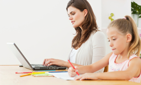 mom with daughter on computer