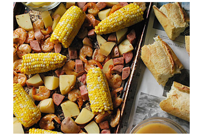 You might not hear the rush of waves, but you're certain to hear the sound of hurried feet as your family clamours to the table for this eat-with-your-fingers dinner that's a party on the plate. Chopped potatoes, corn on the cob, cured sausage and seasoned shrimp combine to make a mainland meal that rivals any coastal concoction.