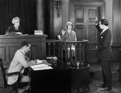stock-woman-testify-court-2 stock-woman-testify-court-2
