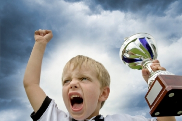 kid-winning-with-trophy kid-winning-with-trophy