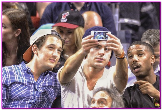 51313296 Actors Zac Efron, Miles Teller and Michael B. Jordan sit courtside to watch the Miami Heat on January 23, 2014 in Miami, Florida. FameFlynet, Inc - Beverly Hills, CA, USA - +1 (818) 307-4813