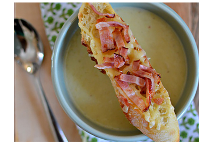 This classic potato and leek soup topped with Irish cheddar and bacon toasties is so good it'll make you want to kiss the Blarney stone, or at least kiss the cook who made it. The soup can be made and stored in the fridge for up to three days, requiring only a quick reheat before serving. 