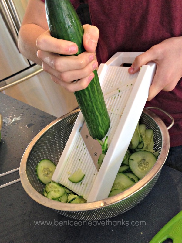 Slicing-cucumbers-with-a-mandolin