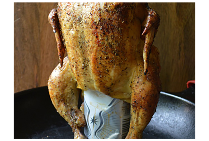 While the chicken may look a little ridiculous perched on top of a can of partially consumed beer, this method of cooking actually results in a flavourful and tender piece of meat. The chicken dry roasts on the outside while simultaneously is bathed with beer on the inside resulting in a perfectly cooked piece of protein.