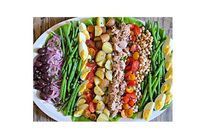 Simple and stunning are apt descriptors for this guest-worthy salad platter that's a cinch to put together—despite the lengthy list of ingredients. Serve with a loaf of crusty bread, quality cheeses and chilled rose for a French-inspired dinner your friends will fawn over.