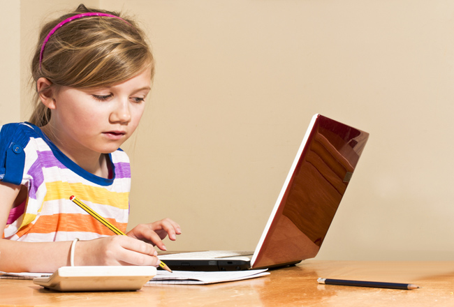 girl-doing-homework-at-desk