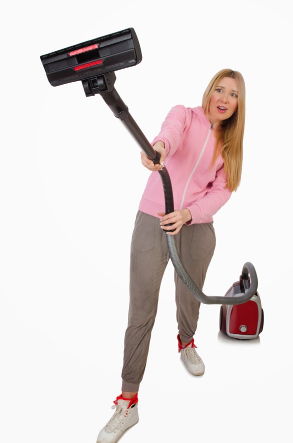 kozzi-young_woman_with_vacuum_cleaner_on_white-586x886