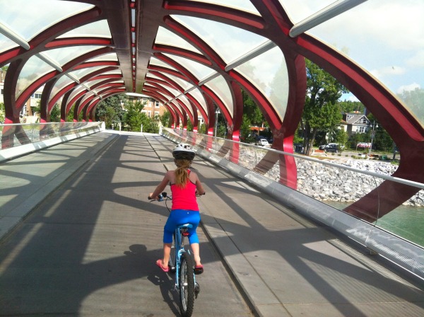 Child-cycling-over-pedestrian-bridge