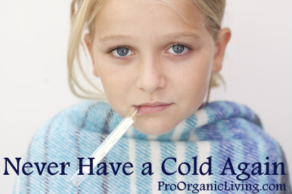 Close up of child with fever thermometer, wrapped in blanket