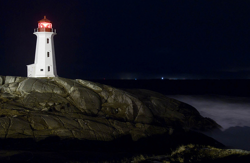 The rocks at Peggy's Cove are notoriously dangerous, and a layer of ice on them certainly doesn't help things.This shot was captured late in the evening during a winter storm, though the conditions are brutal out in the open, they cease immediately when you step behind a rock. Thank goodness for that!