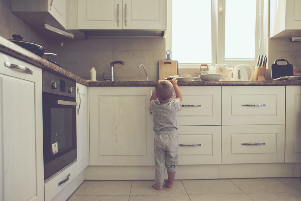 Child Reaching Up for Food