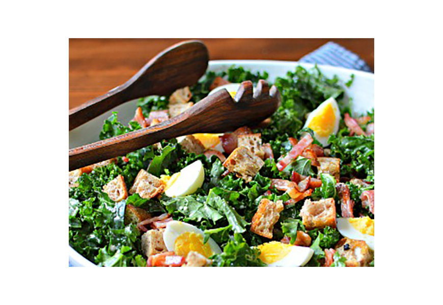 Kale salads are delicious when made in advance as the hearty, tough leaves soften slightly under the drizzle of a simple dressing. The addition of hard-boiled eggs and bacon makes this an updated healthy take on breakfast for dinner. 