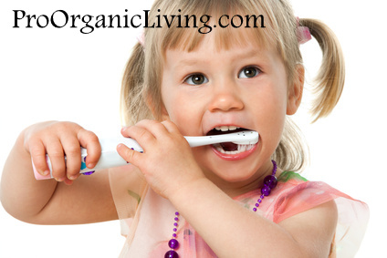 Close up portrait of little girl brushing teeth.Isolated on white background.
