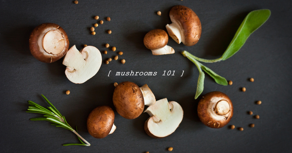 Mushrooms 101, cremini mushrooms on black surface with herbs